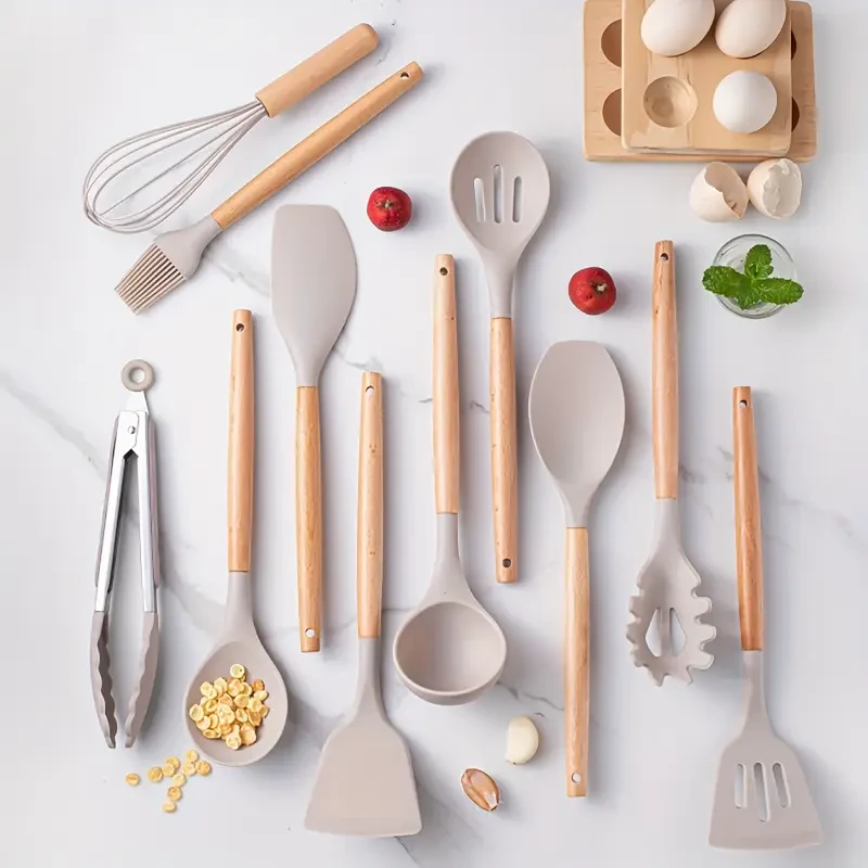 Upgrade your cooking with the 12pcs Silicone Kitchen Utensil Set with Wooden Handles. Heat-resistant, BPA-free, and non-stick, this stylish set is perfect for New Zealand kitchens. Includes turner, spatula, ladle, whisk, and more with a holder for organiz