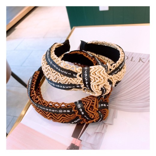 Handmade twisted letter ribbon with knotted headband in the middle