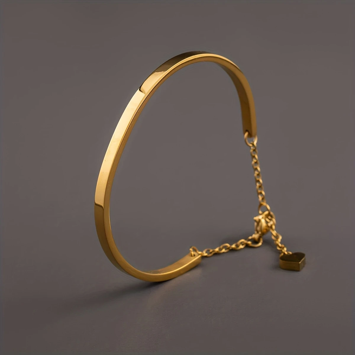 Golden-Plated Stainless Steel Heart Pendant Bracelet with Chain Extension Unisex Fashion Accessory for Men and Women, Perfect for Couples or Casual Attire