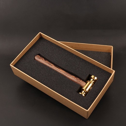 Small hammer with brass handle