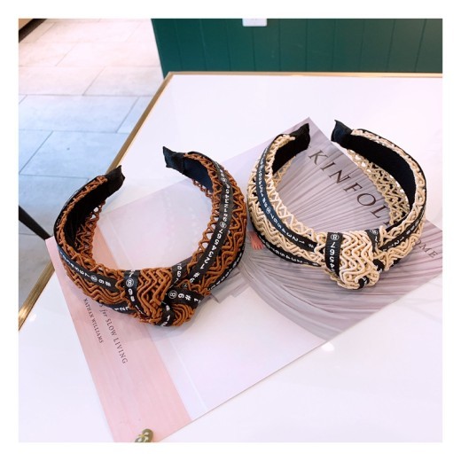 Handmade twisted letter ribbon with knotted headband in the middle