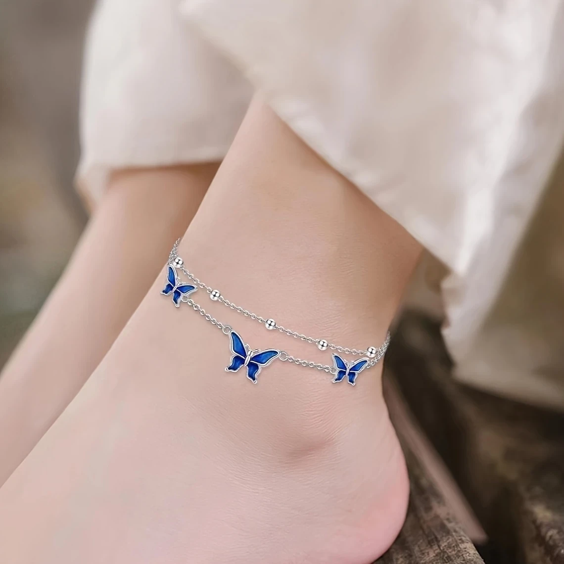 White Golden Butterfly Anklet Elegant White Golden-Plated Copper Butterfly Anklet with Blue Enamel Accents